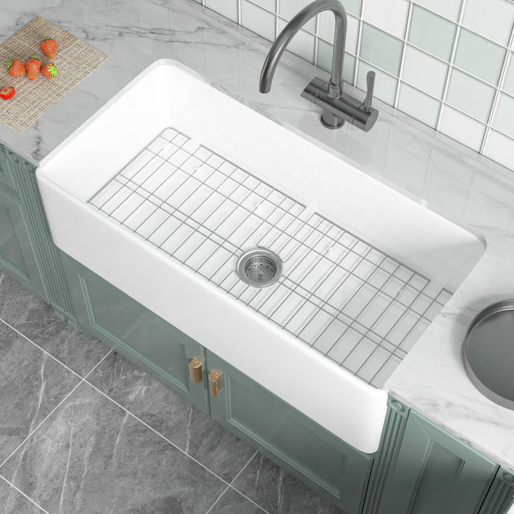91.44cm Oversized Apron-Front Kitchen Sink   91.44cm × 45.72cm × 25.4cm double-sided apron-front single bowl, undermount installation. Made of solid fireclay in bright white, this farmhouse-style sink is durable and ideal for kitchens.